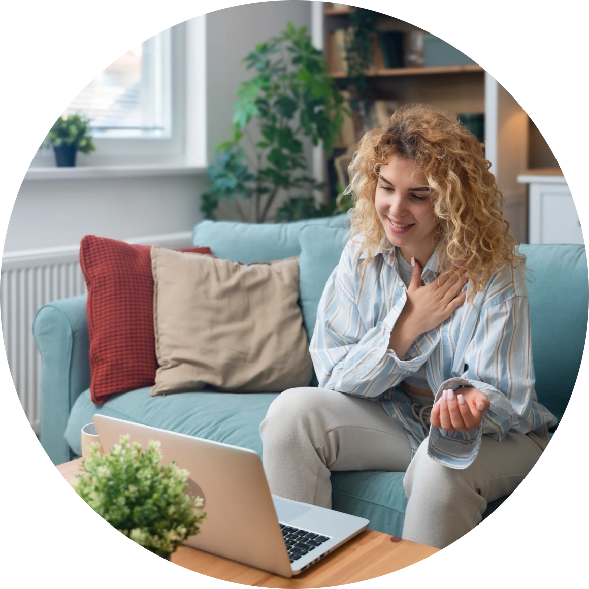 Smiling woman using laptop in living room